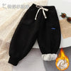 Black thick winter sports pants for kids with fleece lining.