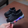 Black children's sports shoes with LED light-up soles