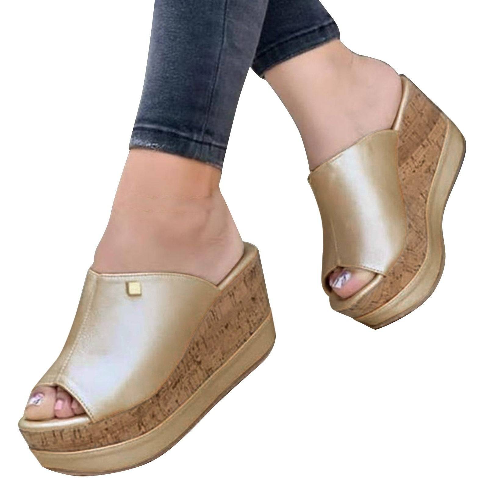 Gold Roman-style wedge sandals on model, showcasing cork platform and elegant design for women’s summer wear.