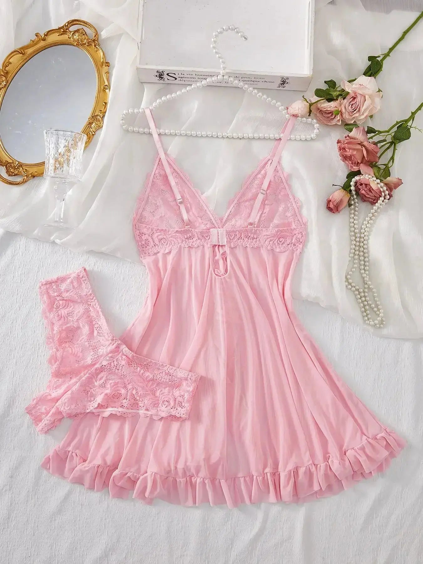 Back view of pink lace V-neck nightdress with ruffled hem and adjustable straps, part of a soft women's sleepwear set.