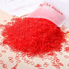 Bright red elastic hair bands scattered