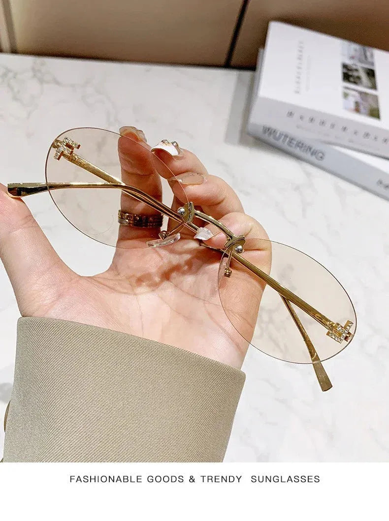 Rimless Oval Sunglasses with Diamond Accent F Letter Design