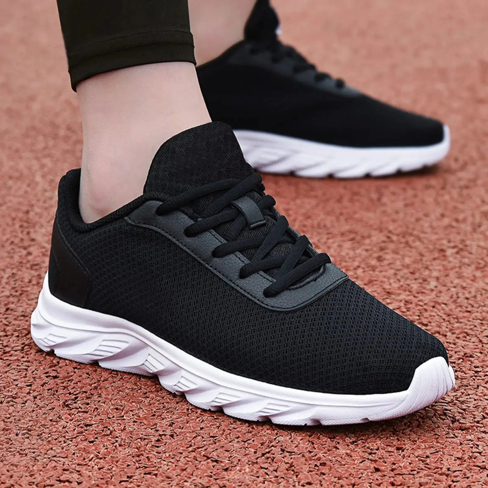 Men's breathable mesh leather sneakers with white sole, styled for summer casual and athletic wear.