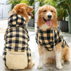 Dog in yellow plaid winter coat with hood