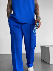 Blue men's casual pants with elastic waist and comfortable design.