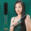 Woman using 2 in 1 electric hair straightener brush