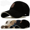 Assorted cotton baseball caps in black, beige, navy, and khaki.