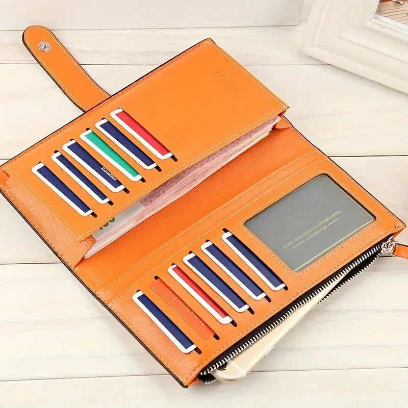 Interior view of orange women's PU leather bifold long wallet showing multiple card slots, photo holder, and zippered compartment.