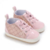 Pink quilted baby sneakers with laces