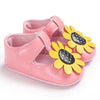 Pink baby shoes with sunflower design