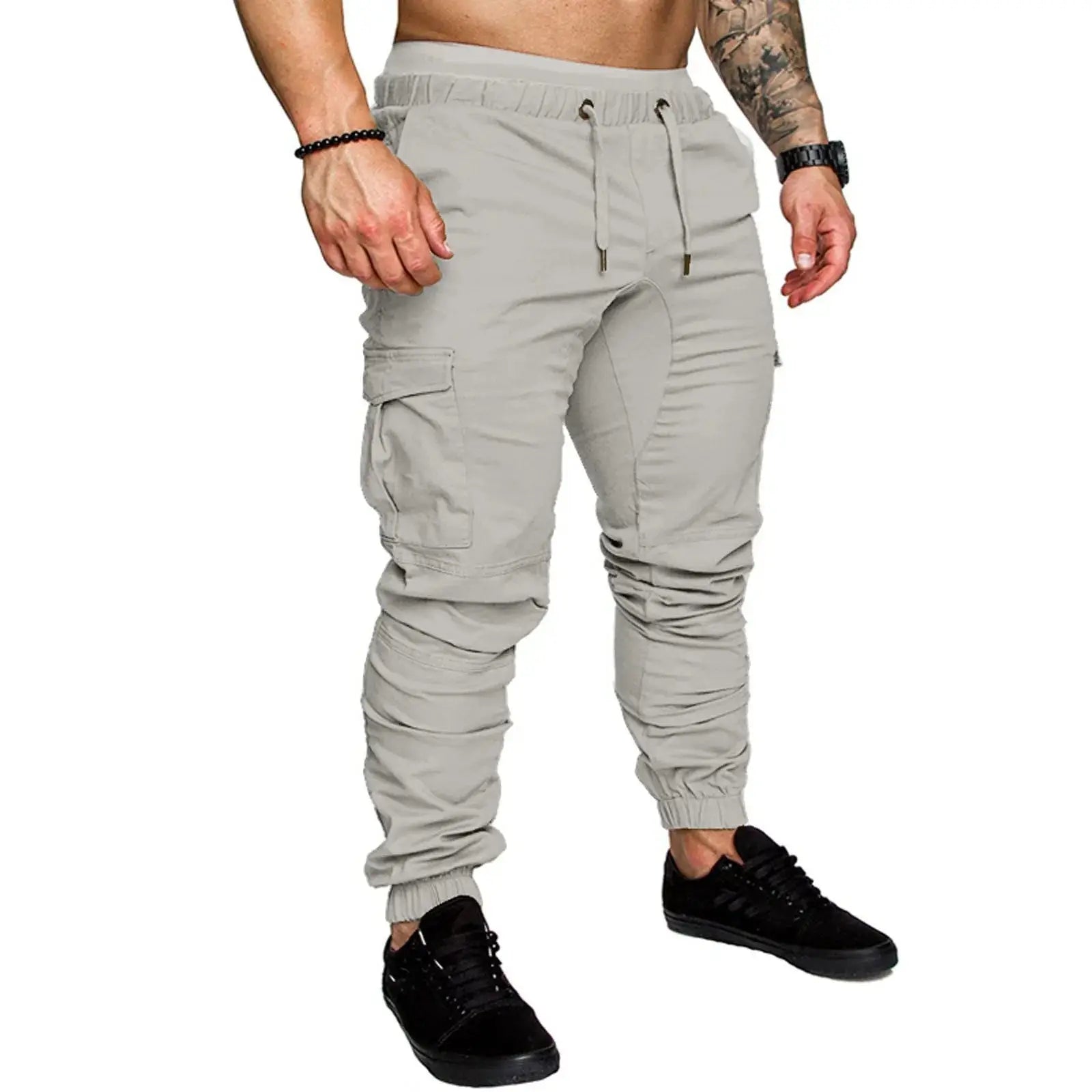 Light gray men’s ankle-tied skinny cargo pants with drawstring and flap pockets, ideal for daily and fitness use.