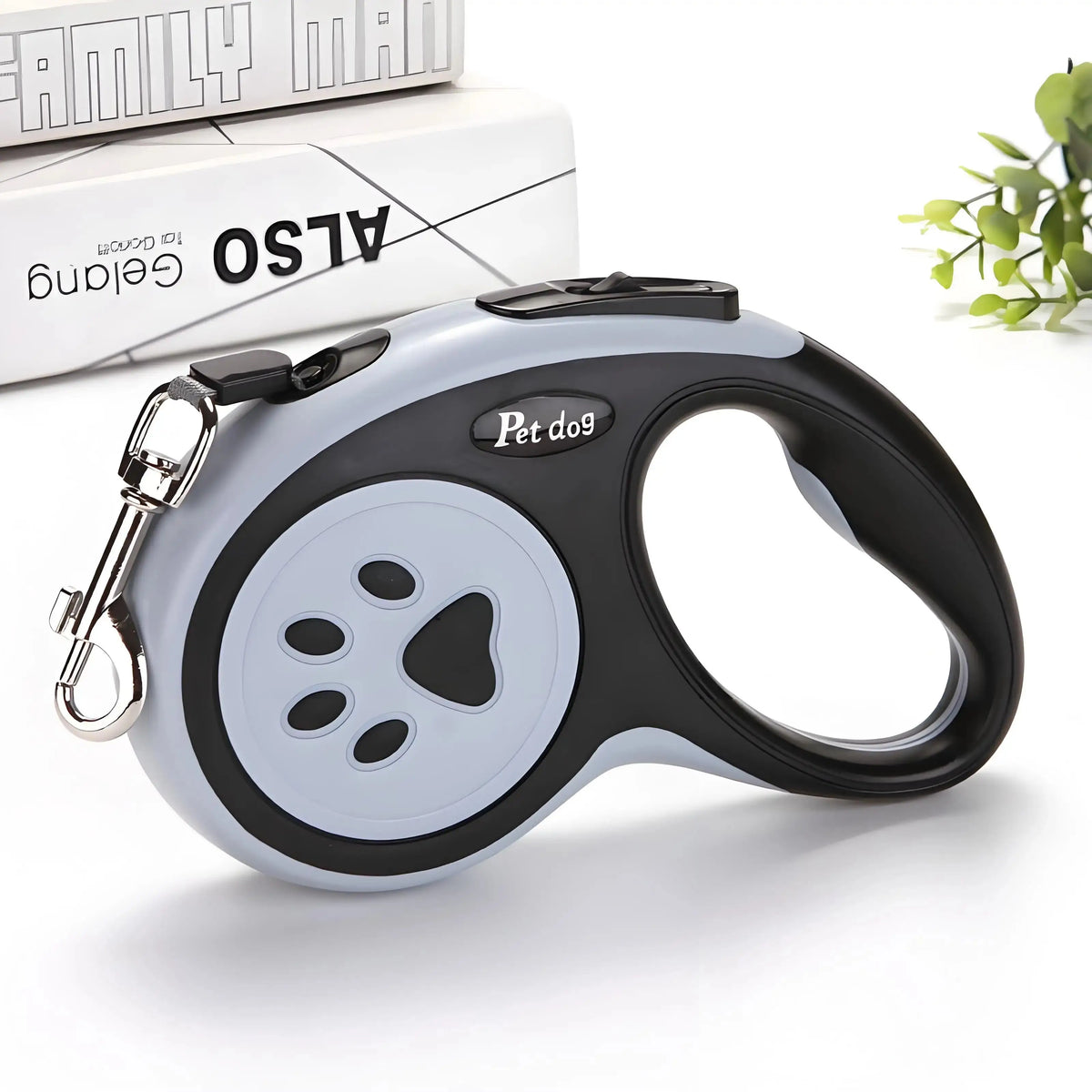Black and gray Automatic Retractable Nylon Pet Leash with ergonomic grip. Strong extending lead for small pet walking and running activities.