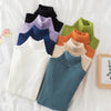 Colorful women's turtleneck sweaters folded