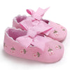 Pink embroidered baby shoes with bow