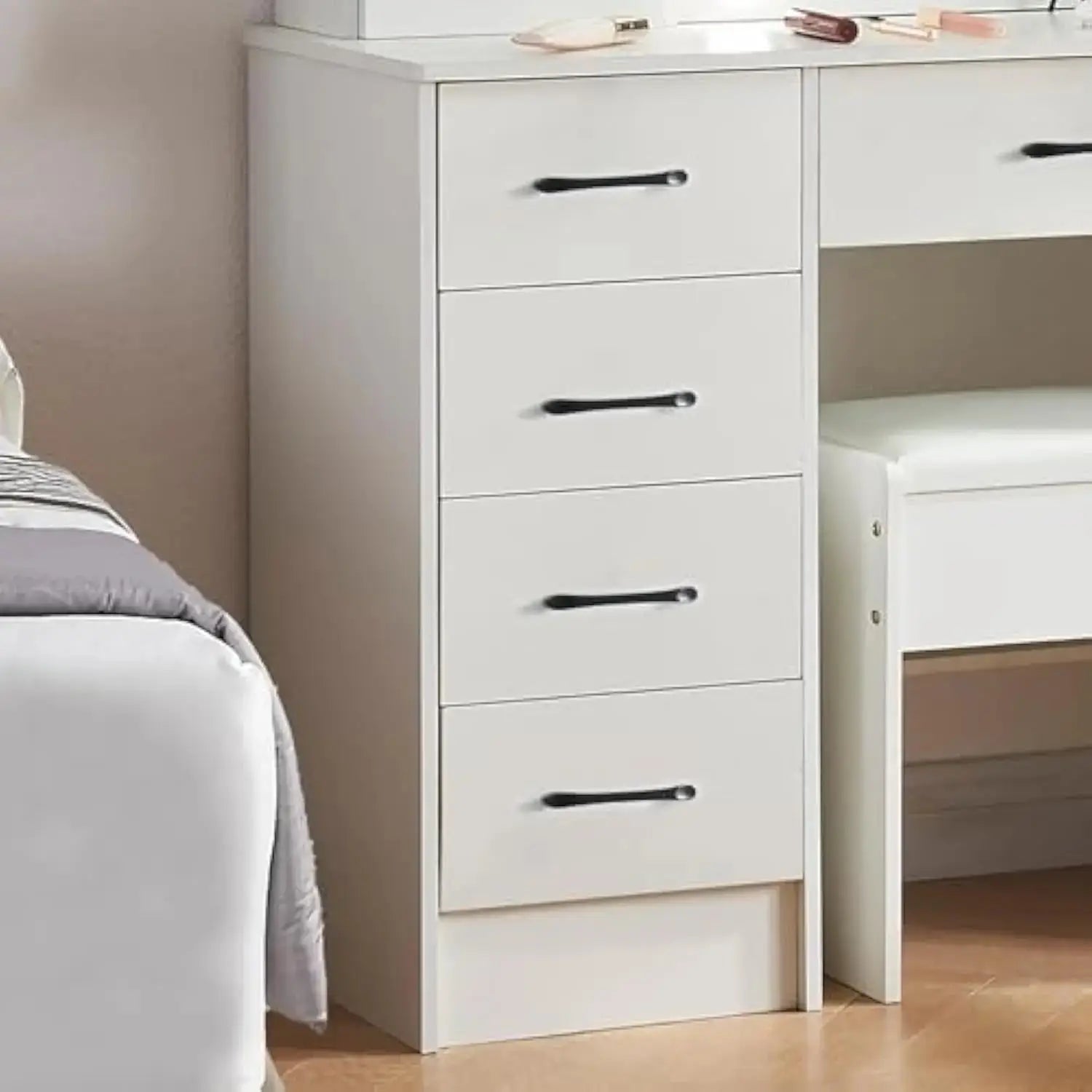 Side view of white vanity desk highlighting 5 spacious drawers with black handles, part of a bedroom makeup vanity furniture set.