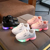 Unisex LED sneakers for kids in black, white, and pink.