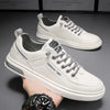 White men's leather shoes with gray laces, stylish and durable design.