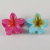 Shiny flower hair clips in pink and blue tones