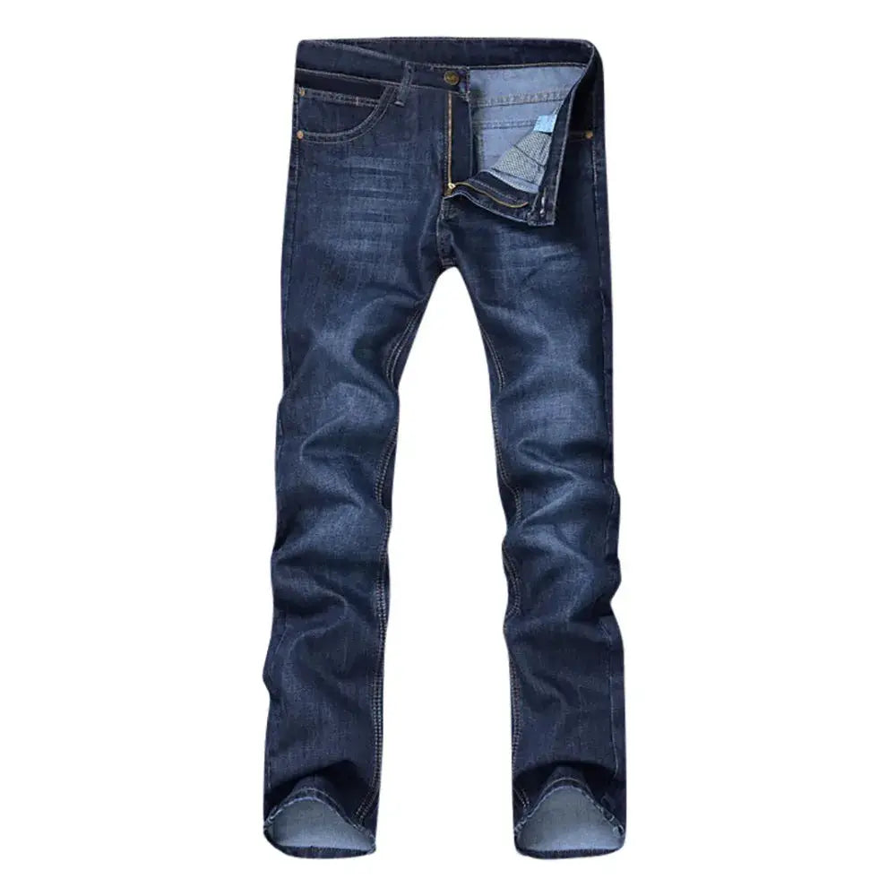 Front view of men’s straight fit stretch denim jeans laid flat, highlighting casual streetwear design and faded wash.
