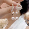 Elegant double pearl dangle earrings with crystal accents