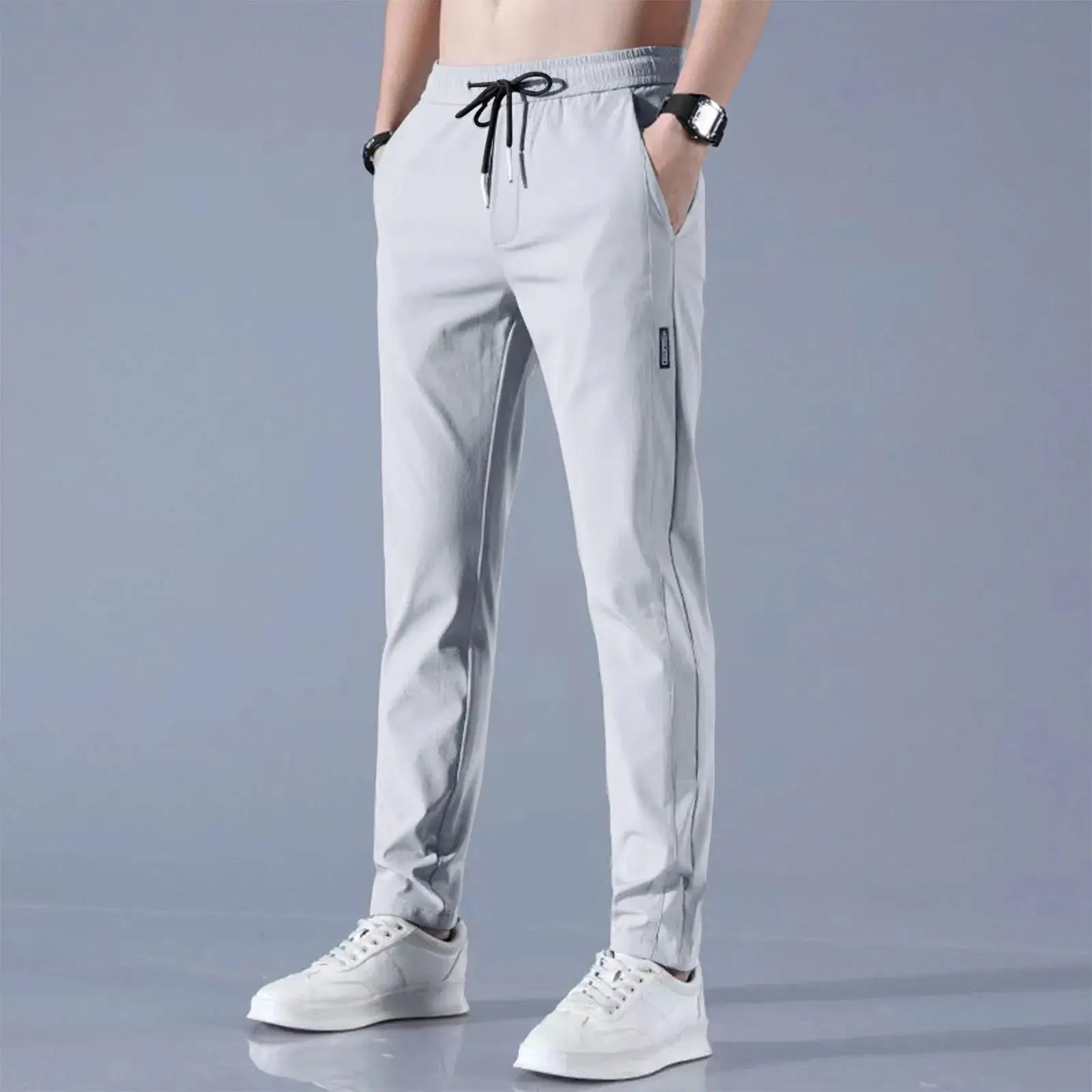 Light gray men’s quick-dry stretch pants with breathable ice silk fabric, mid-waist loose fit and straight-leg design for versatile wear.