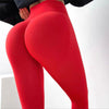 Bright red high waisted sports pants close-up