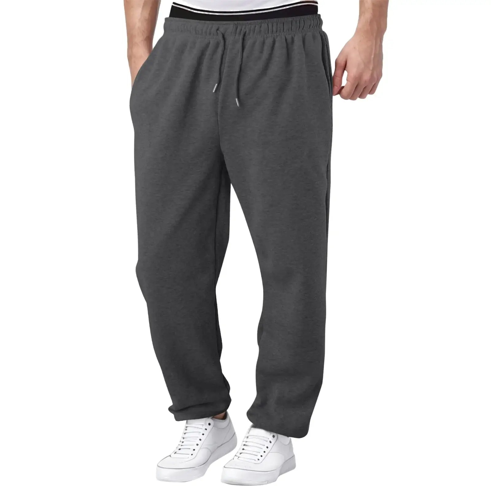 Charcoal grey men’s jogger pants, lightweight and breathable with elastic waist, suitable for workouts and casual use.