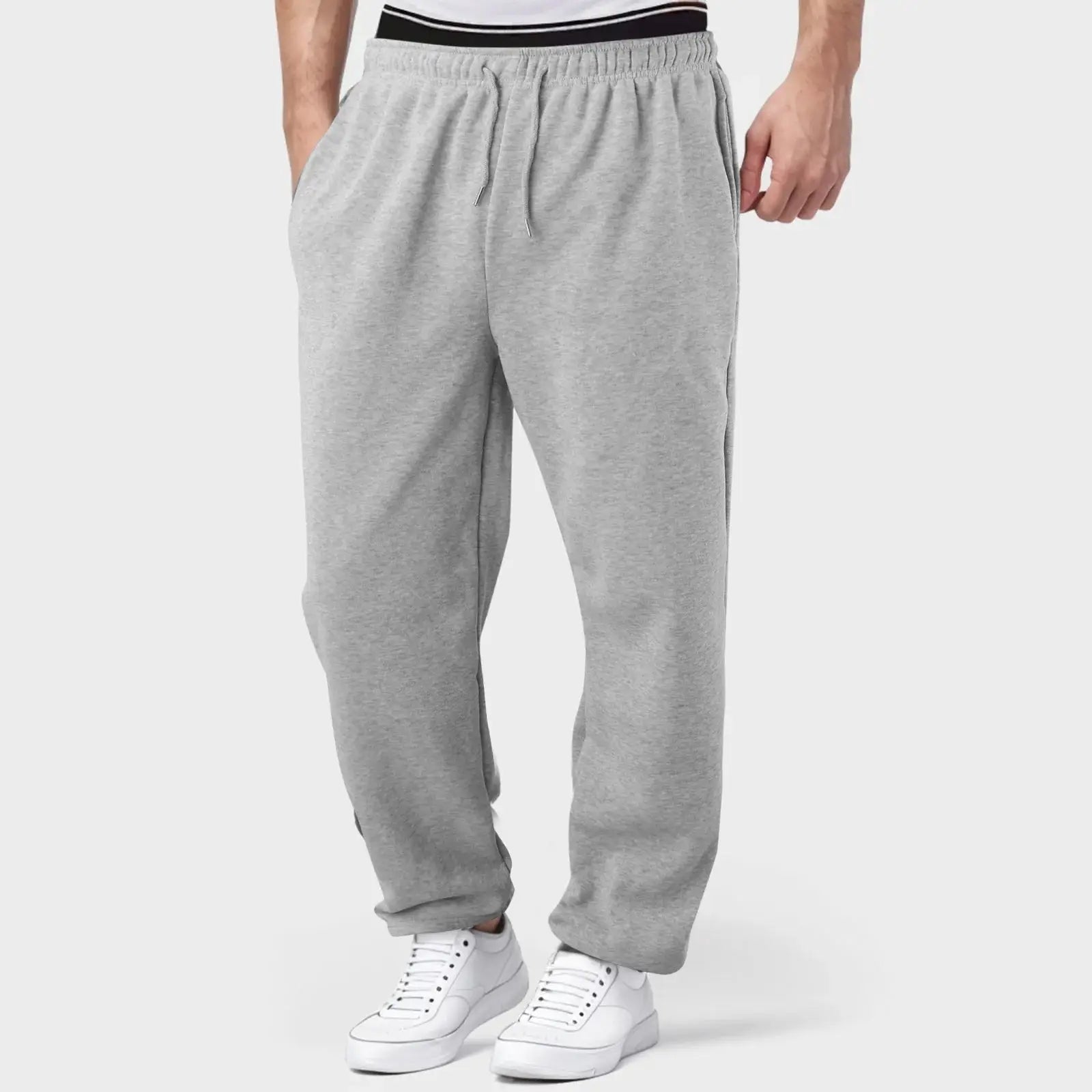 Light grey men’s jogger pants with drawstring waist, breathable and lightweight for workouts, running, or casual use.
