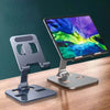 Foldable phone desk stand holding tablet