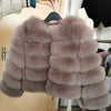 Taupe faux fur coat on hanger