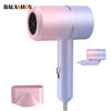 Pink and purple mini foldable hair dryer with attachment