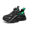 Black children's sneakers with green accents, anti-slippery design