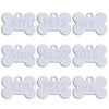 Nine white bone shaped dog ID tags