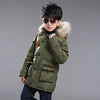 Green hooded winter jacket with fur trim for children