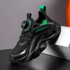 Black children's sneakers with green accents, anti-slippery design