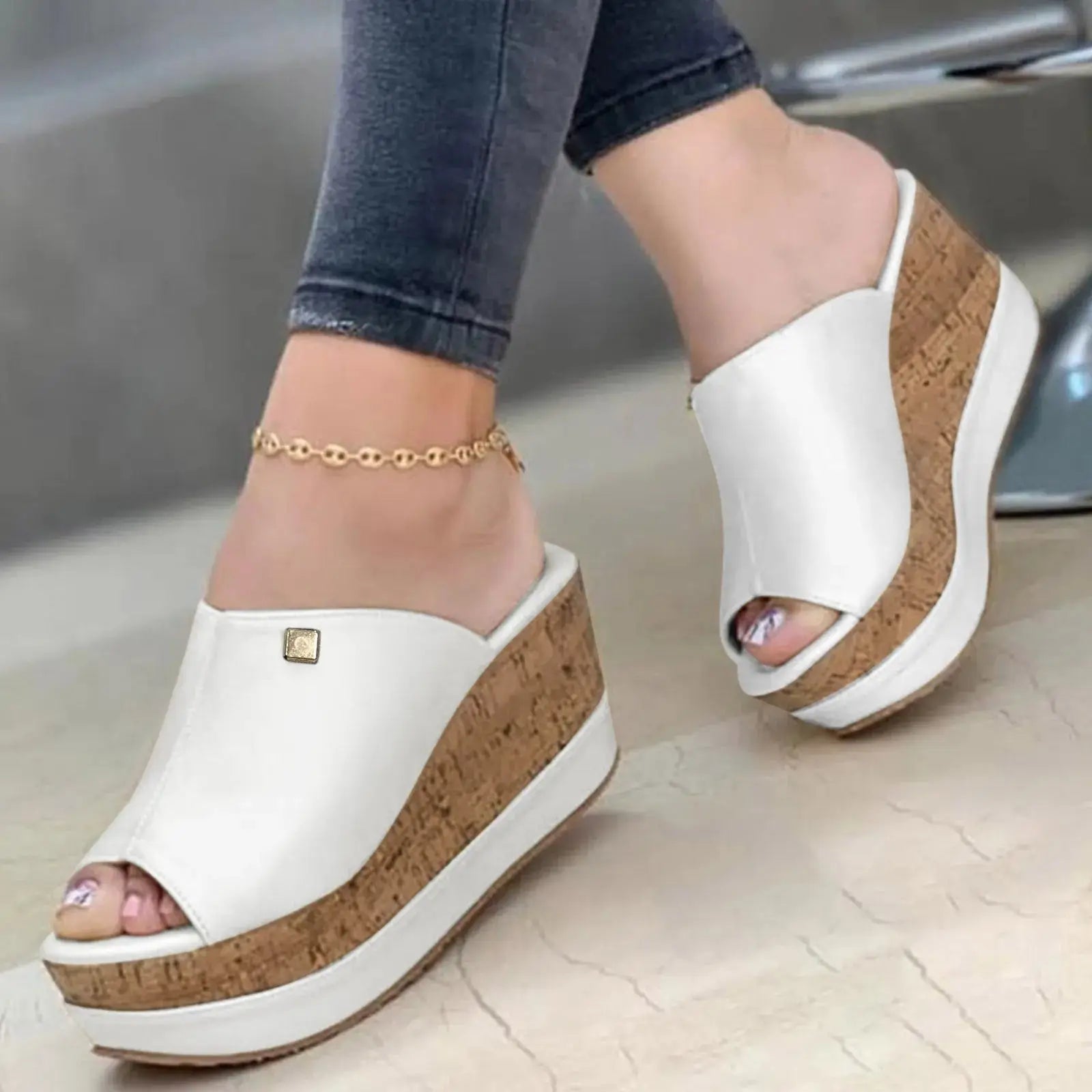 White Roman-style wedge sandals for women featuring a cork platform, designed for elegant and casual summer wear.