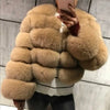 Beige faux fur coat worn by person