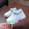 White children's sports shoes with colorful LED lights