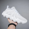 White lightweight mesh sneakers with unique sole design