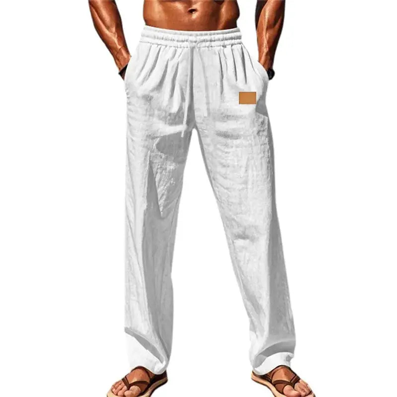 White men’s breathable drawstring pants with elastic waist and relaxed fit, styled for summer or casual wear with a clean look.