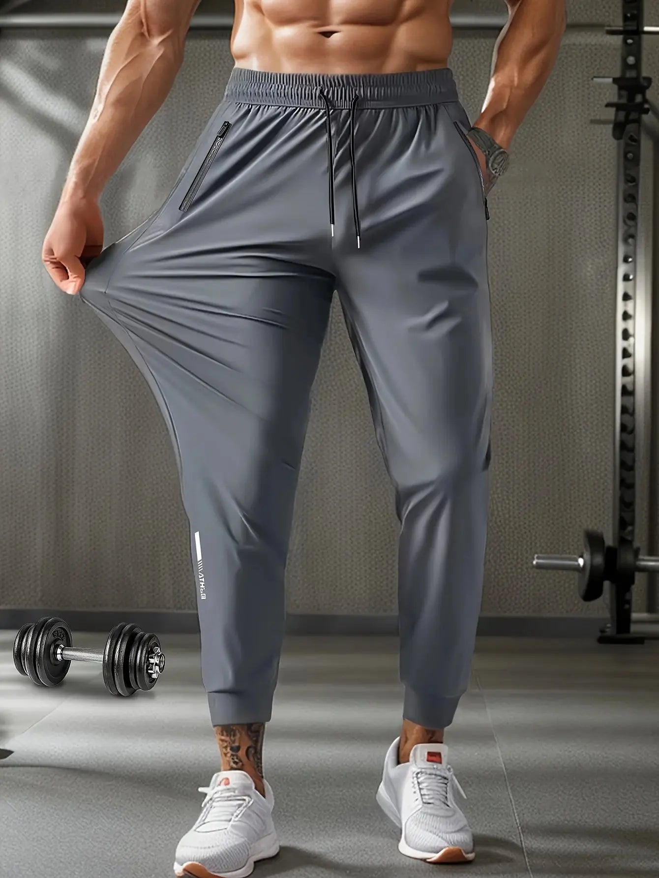 Grey Mens Quick-Dry Training Pants with elastic waistband and zippered pockets, designed for outdoor training and gym performance.