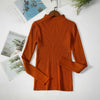 Orange women's turtleneck sweater on hanger