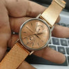 Rose gold watch with mesh strap