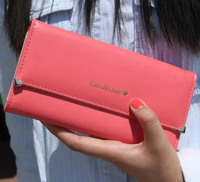 Coral red Women's Long PU Leather Trifold Wallet with gold heart detail, ideal for fashionable and functional daily use.
