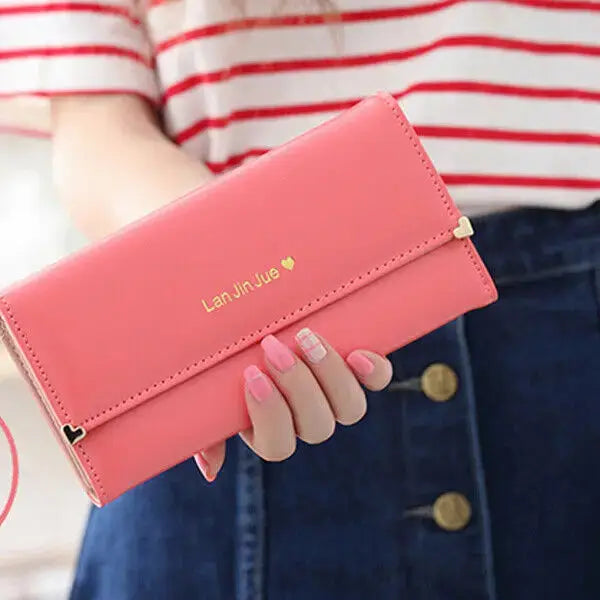 Coral pink Women's Long PU Leather Trifold Wallet with gold heart button detail, perfect for stylish everyday use.