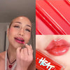 Coral liquid lipstick applied on smiling lips