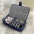 Blue portable jewelry box with organized jewelry.