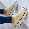 Yellow women's casual shoes with white toe cap