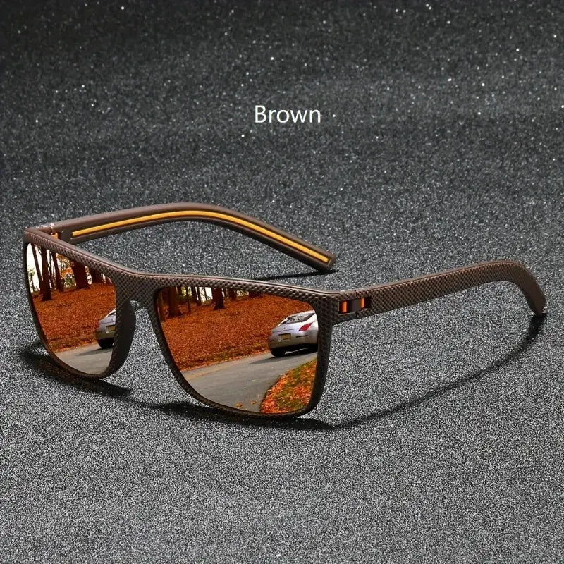 Brown frame vintage square polarized sunglasses with UV400 protection, reflecting an autumn road scene, ideal for outdoor and driving use.