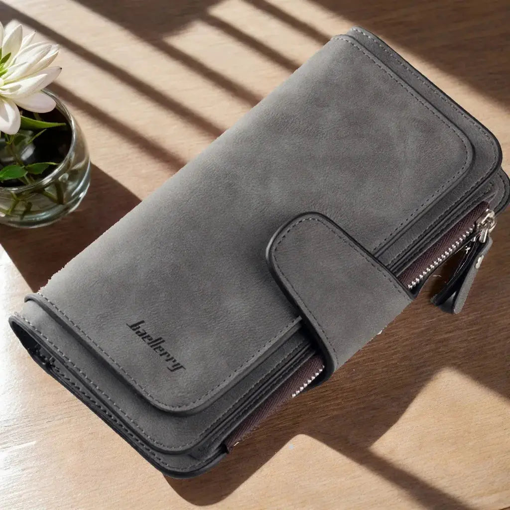 Dark gray women's long trifold wallet with zipper and snap closure, designed for maximum storage and organization.